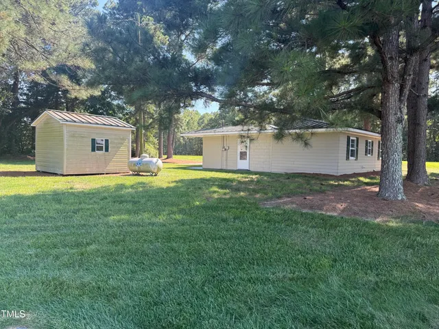 a house view with a sitting space and garden view