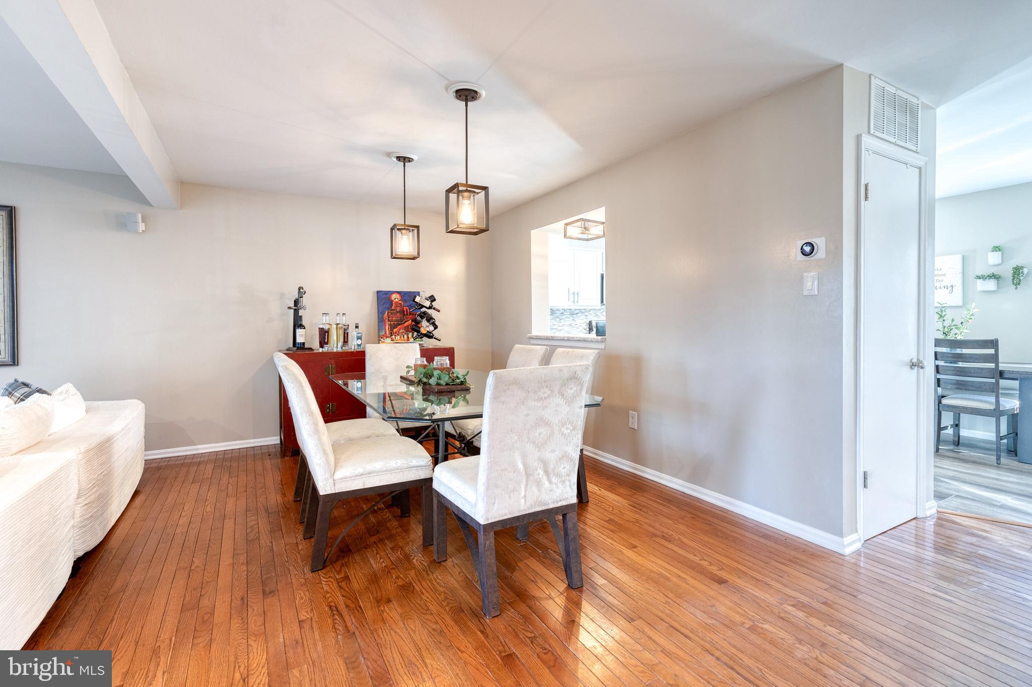 8743 Ruppert Court Ellicott City, MD 21043 - Photo 15 of 41 a view of a dining room with furniture window and wooden floor