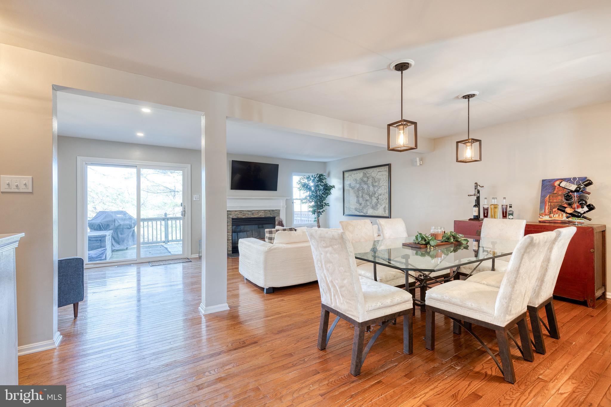 8743 Ruppert Court Ellicott City, MD 21043 - Photo 17 of 41 a view of a dining room with furniture window and wooden floor