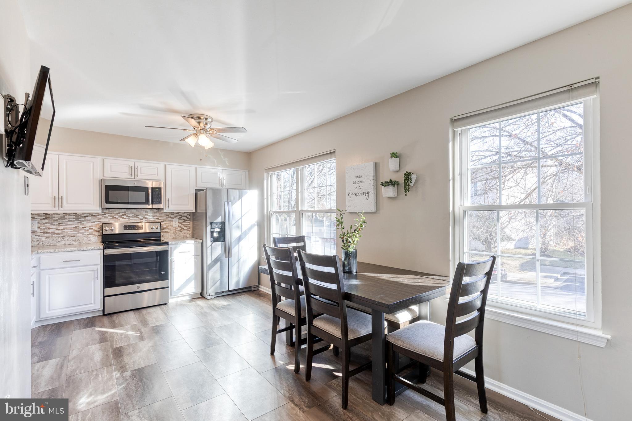 8743 Ruppert Court Ellicott City, MD 21043 - Photo 21 of 41 a view of a dining room with furniture window and wooden floor