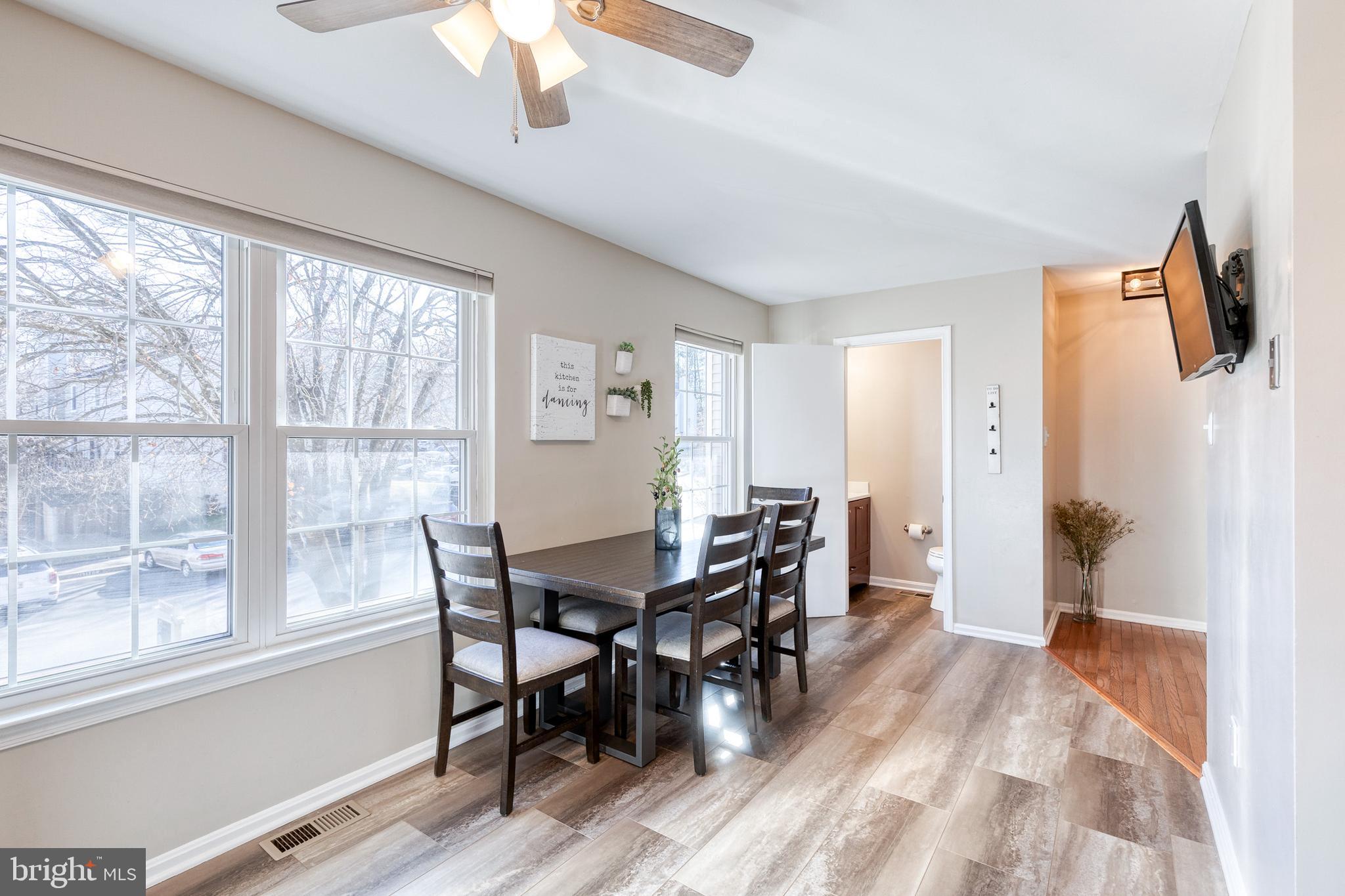 8743 Ruppert Court Ellicott City, MD 21043 - Photo 26 of 41 a view of a dining room with furniture window and wooden floor