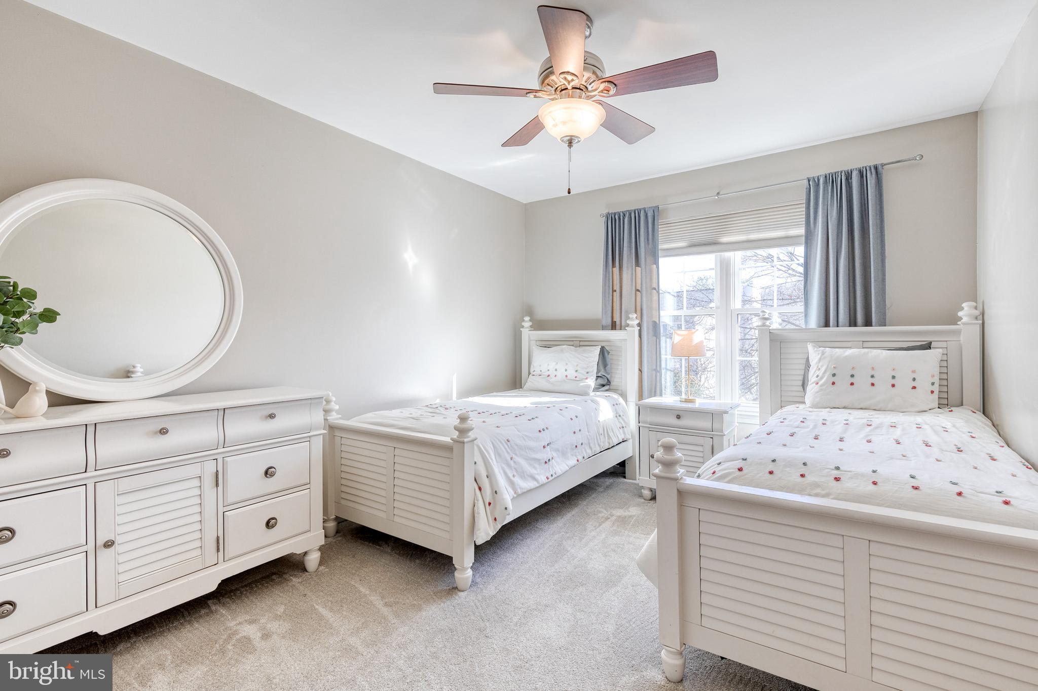 8743 Ruppert Court Ellicott City, MD 21043 - Photo 34 of 41 a bedroom with a bed and a chandelier