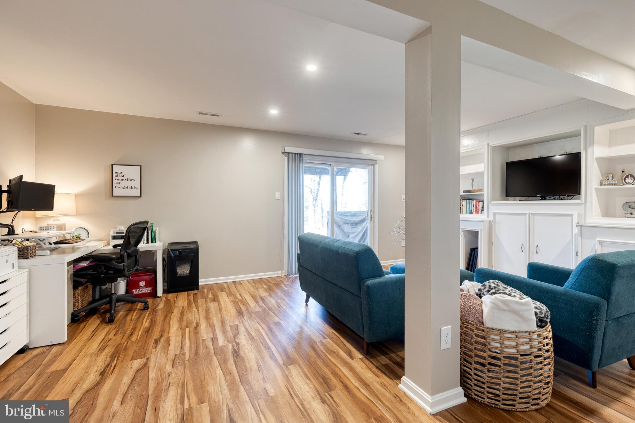 8743 Ruppert Court Ellicott City, MD 21043 - Photo 4 of 41 a living room with furniture and a flat screen tv