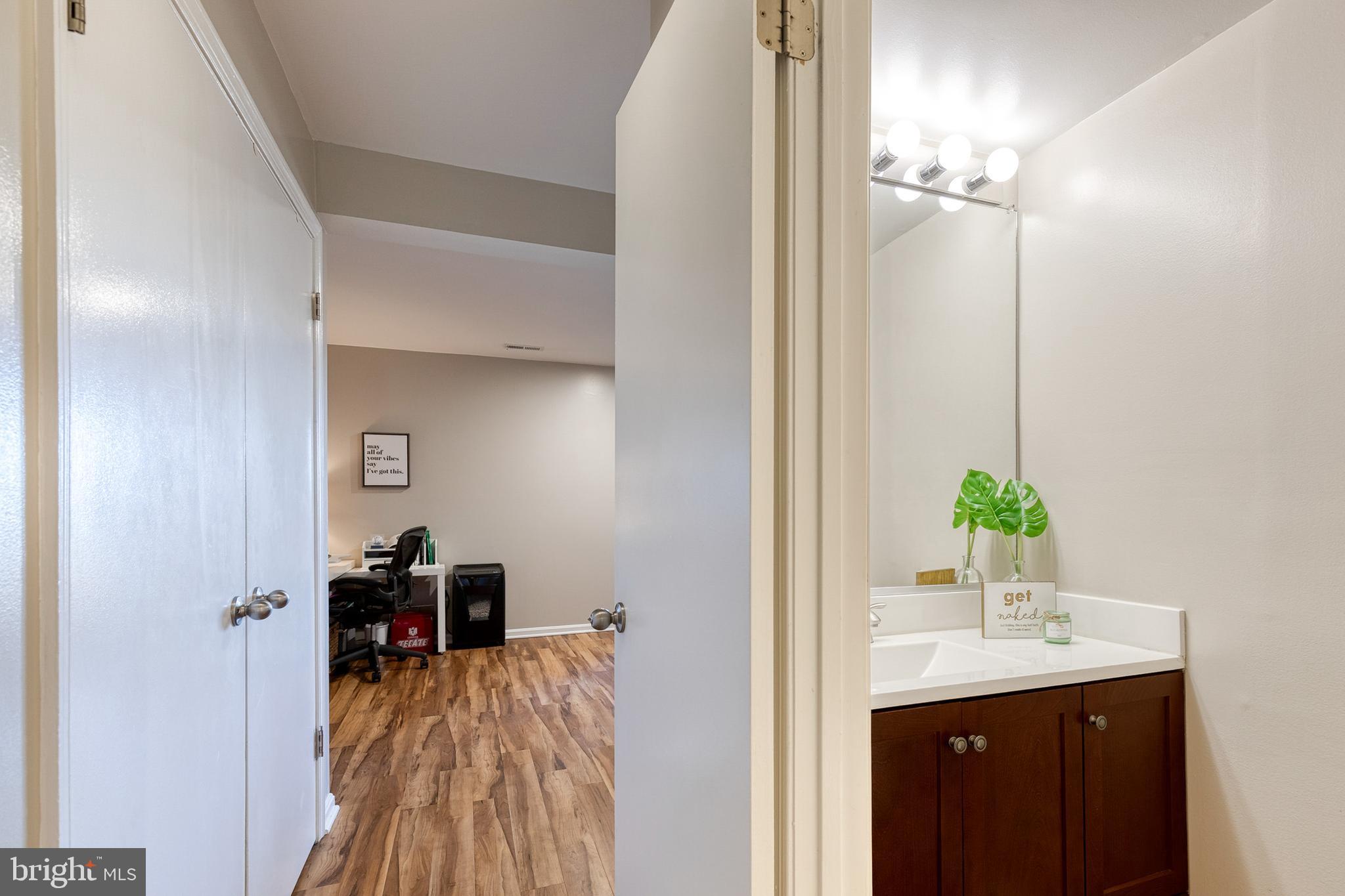 8743 Ruppert Court Ellicott City, MD 21043 - Photo 7 of 41 a bathroom with a sink and a mirror
