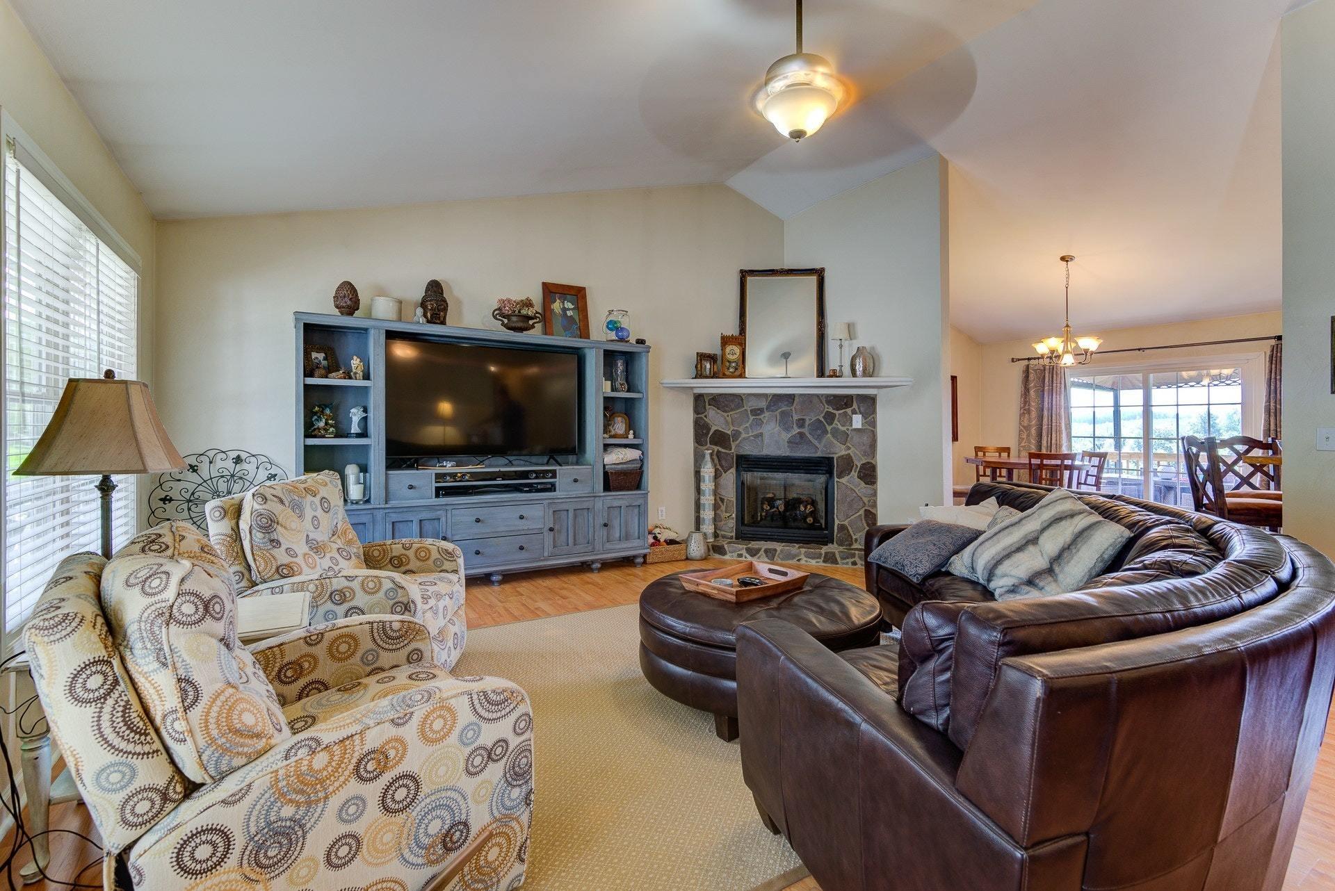 5893 Hardy Road Hardy, VA 24101 - Photo 4 of 37 a living room with furniture a flat screen tv and a fireplace
