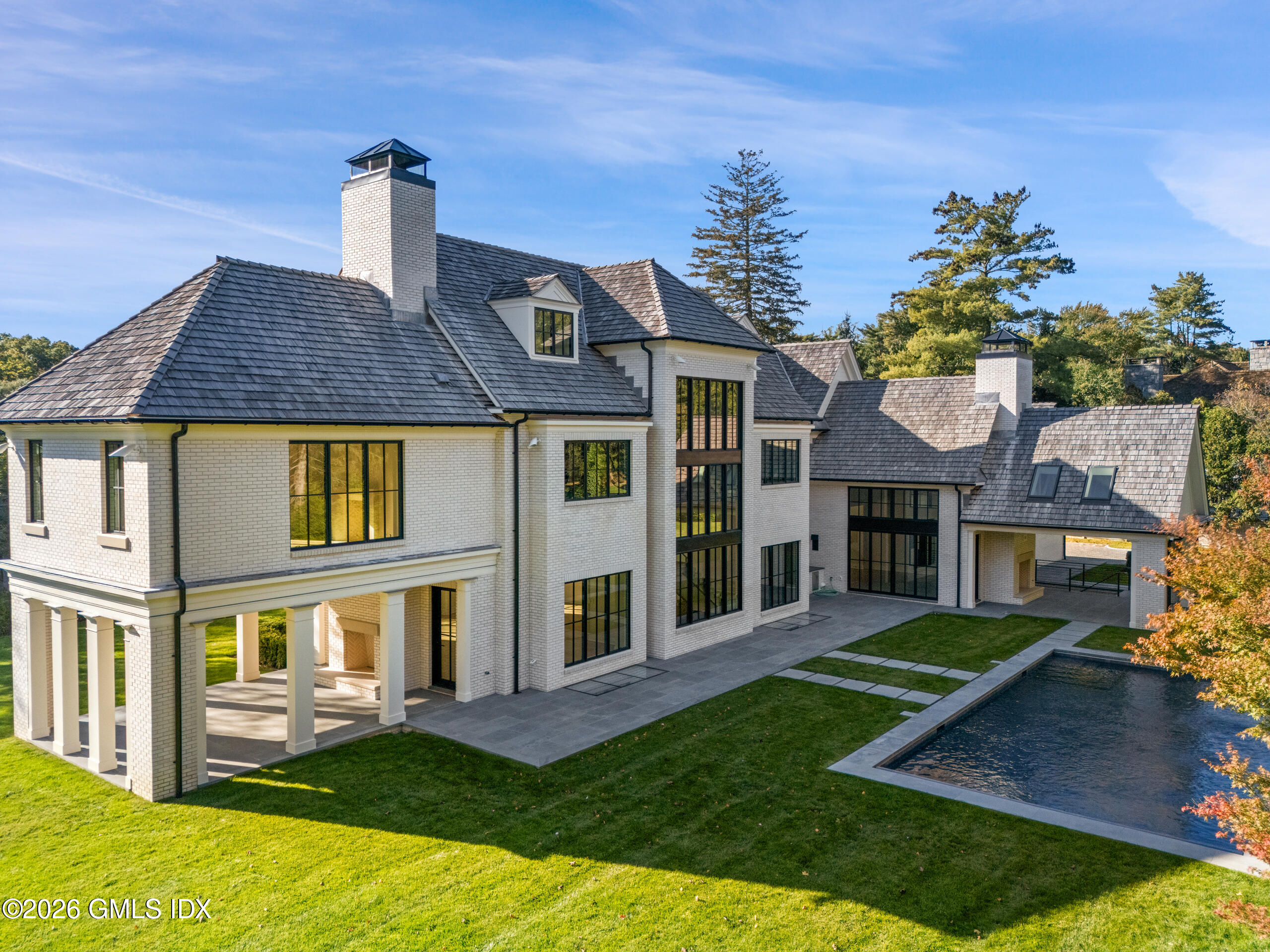 7 Parsonage Road Greenwich, CT 06830 - Photo 39 of 42 front view of a house with a yard
