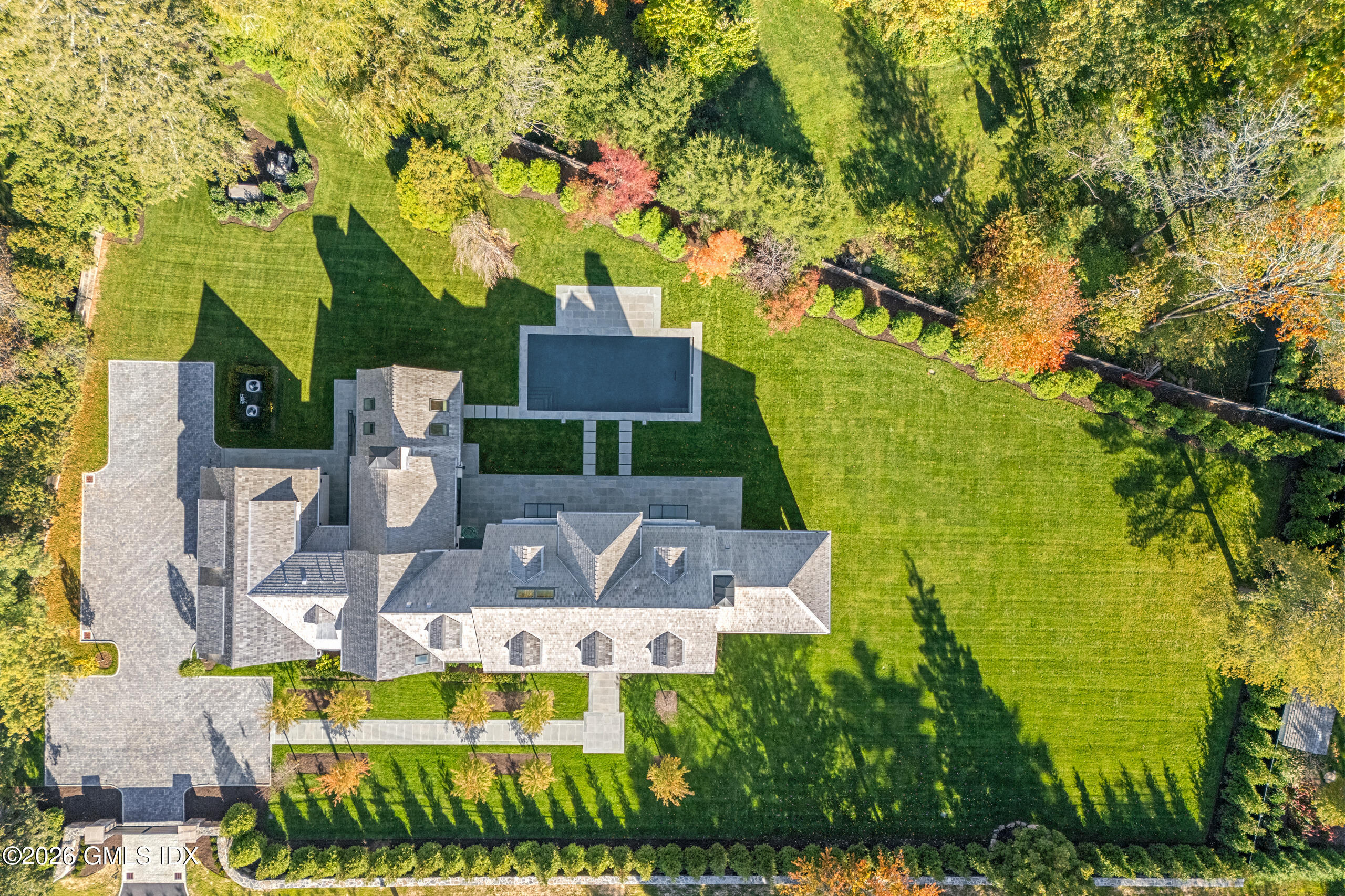 7 Parsonage Road Greenwich, CT 06830 - Photo 41 of 42 an aerial view of a house with swimming pool outdoor seating and yard