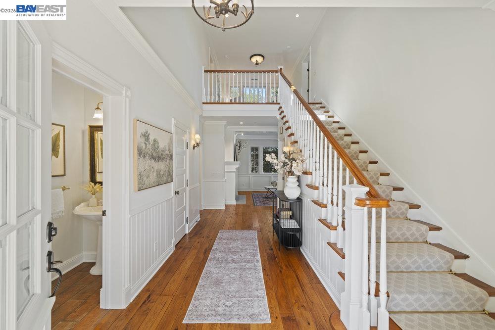 5280 Sheridan Road Sunol, CA 94586 - Photo 12 of 60 a view of a hallway with wooden floor and staircase