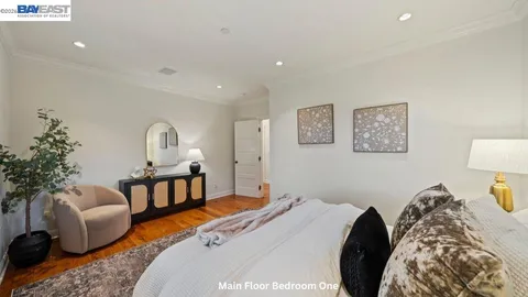 a living room with furniture a window and a table