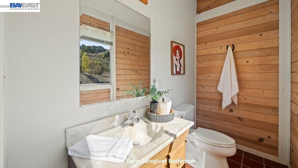 5280 Sheridan Road Sunol, CA 94586 - Photo 52 of 60 a bathroom with a toilet a sink and a window