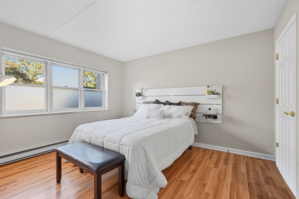 16 Maple Crest Circle, Unit B Holyoke, MA 01040 - Photo 11 of 24 a bedroom with a bed and a window