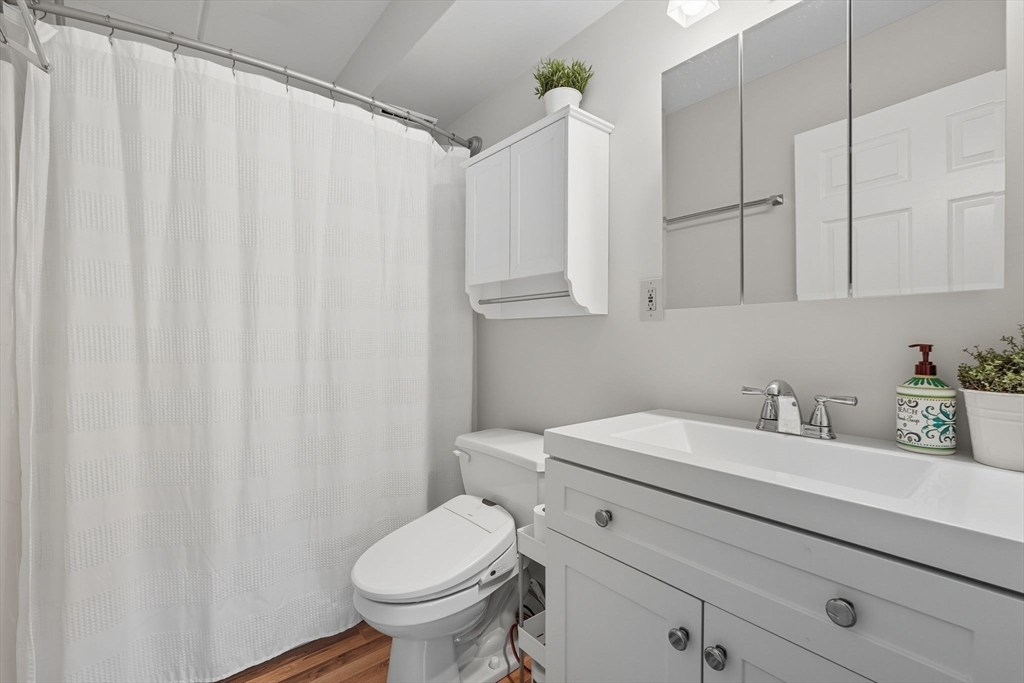 16 Maple Crest Circle, Unit B Holyoke, MA 01040 - Photo 16 of 24 a bathroom with a sink a toilet and a mirror