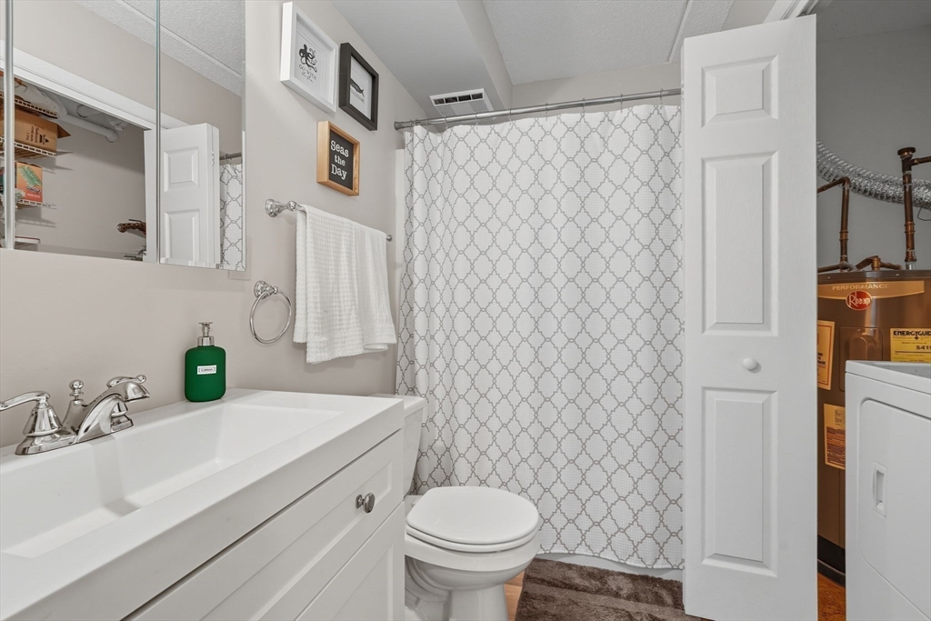 16 Maple Crest Circle, Unit B Holyoke, MA 01040 - Photo 17 of 24 a bathroom with a sink toilet and shower