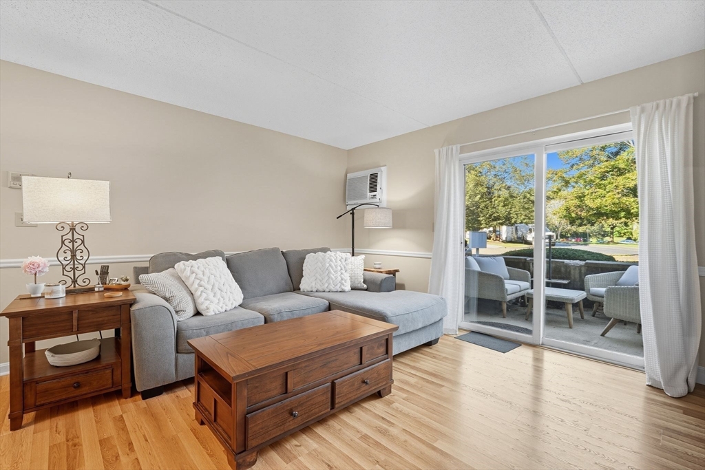 16 Maple Crest Circle, Unit B Holyoke, MA 01040 - Photo 2 of 24 a living room with furniture and a wooden floor