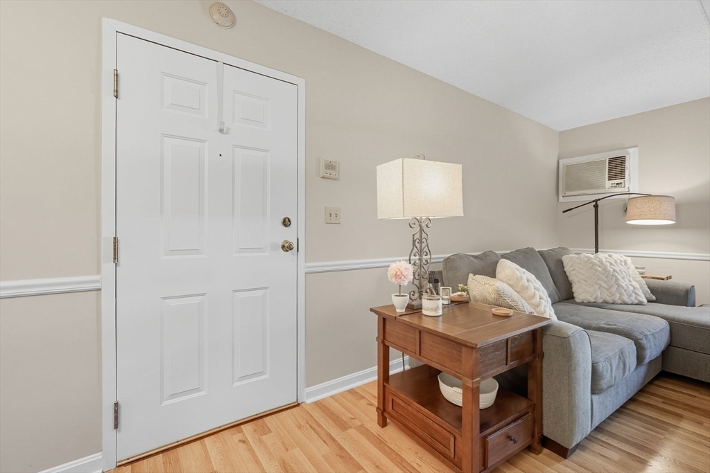 16 Maple Crest Circle, Unit B Holyoke, MA 01040 - Photo 21 of 24 a bed room with furniture and a lamp