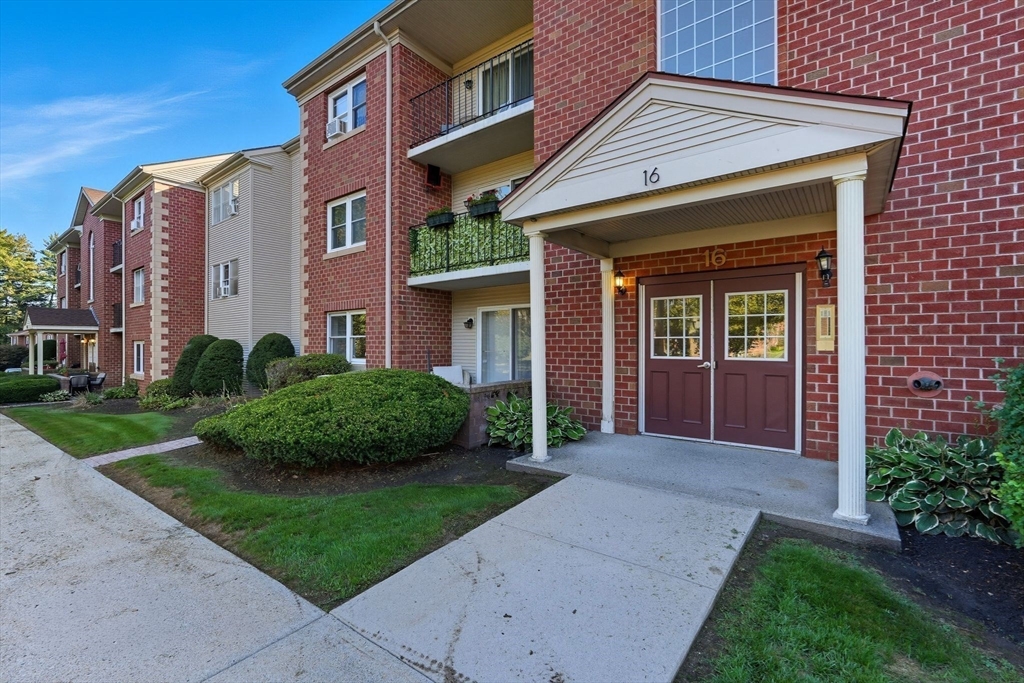 16 Maple Crest Circle, Unit B Holyoke, MA 01040 - Photo 24 of 24 a front view of a house with a yard