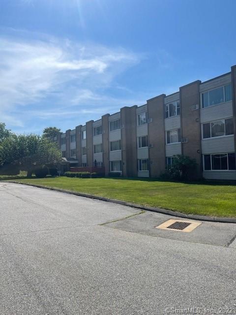 57 Westridge Road, Unit B9 New London, CT 06320 - Photo 12 of 13 a view of a tall building with a yard