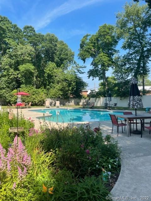 57 Westridge Road, Unit B9 New London, CT 06320 - Photo 13 of 13 a view of a lake with a bench and a yard