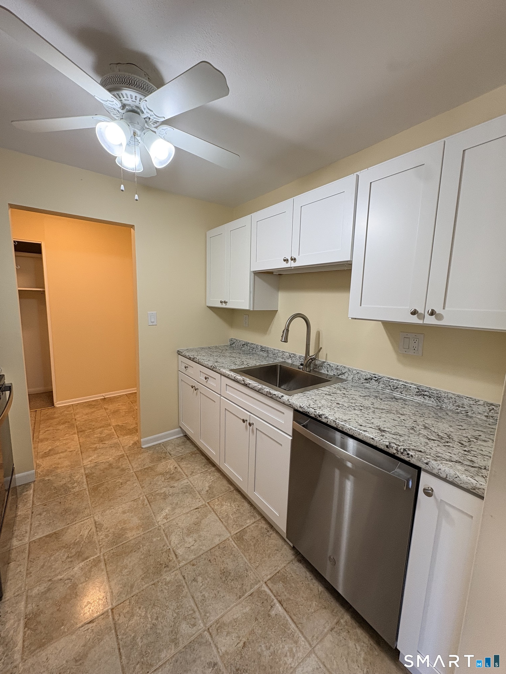 57 Westridge Road, Unit B9 New London, CT 06320 - Photo 2 of 13 a kitchen with granite countertop a sink stainless steel appliances and cabinets