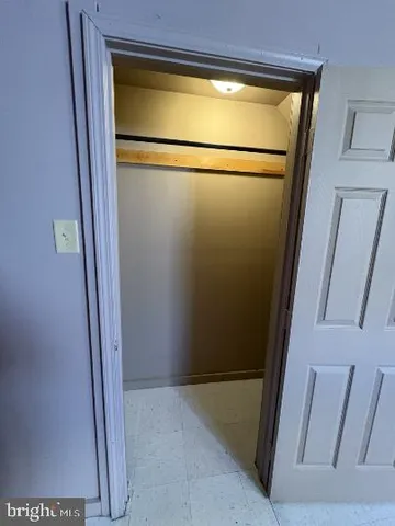 a view of a livingroom with a ceiling fan and window