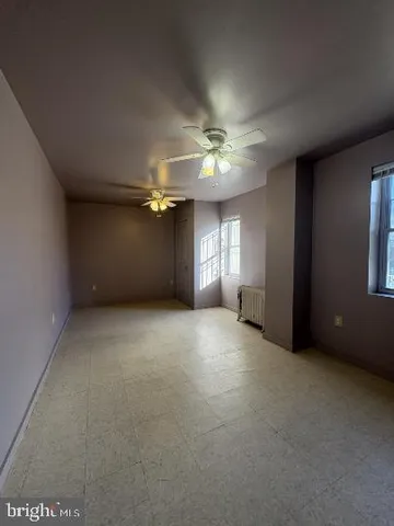 a view of a chandelier fan and a projector