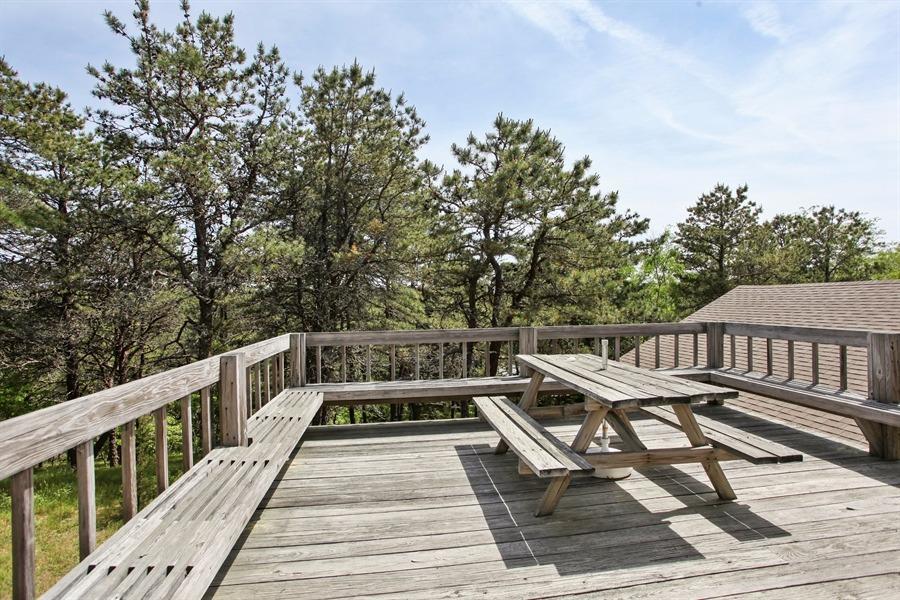 50 Indian Walk Road Wellfleet, MA 02667 - Photo 13 of 21 a view of a roof deck with wooden floor and fence