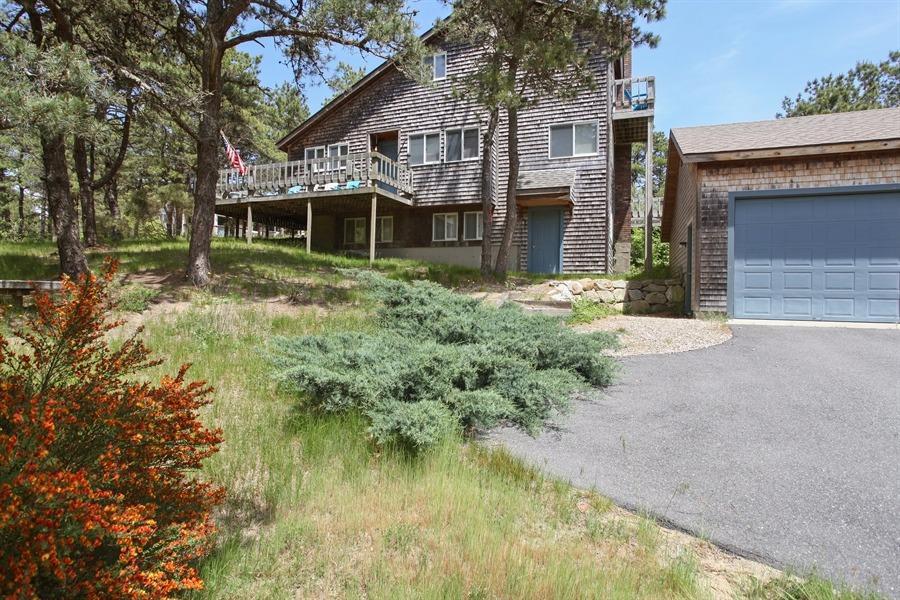 50 Indian Walk Road Wellfleet, MA 02667 - Photo 15 of 21 a front view of a house with a yard and trees