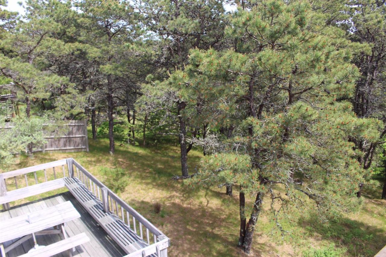 50 Indian Walk Road Wellfleet, MA 02667 - Photo 16 of 21 a view of balcony with wooden floor and fence