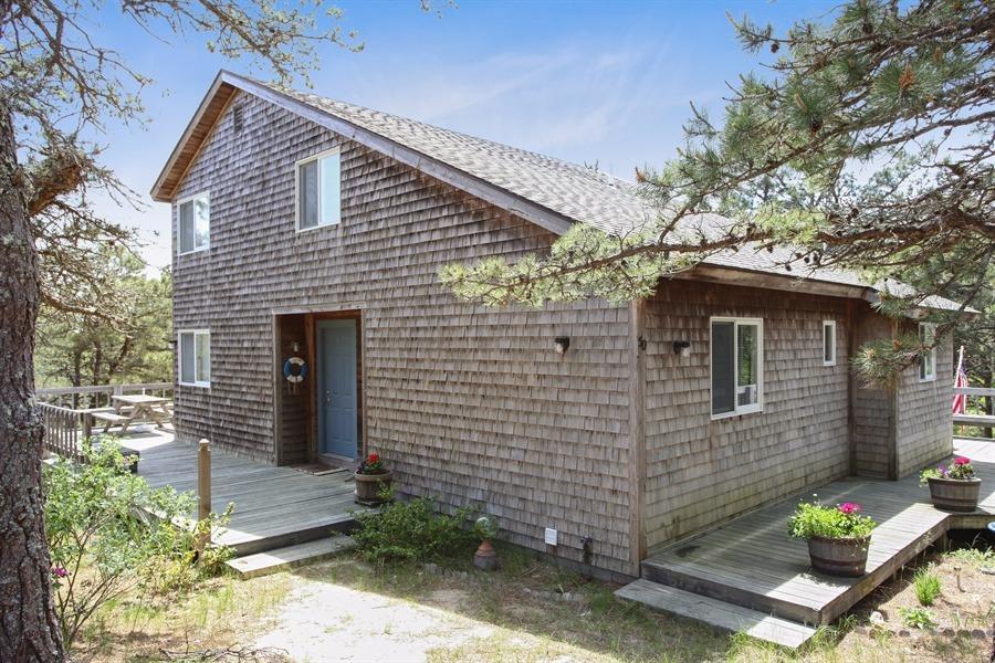 50 Indian Walk Road Wellfleet, MA 02667 - Photo 2 of 21 a front view of a house with garden
