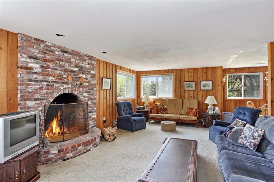 50 Indian Walk Road Wellfleet, MA 02667 - Photo 4 of 21 a living room with furniture a fireplace and a flat screen tv