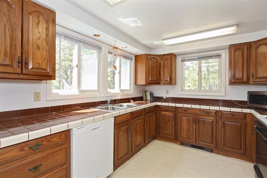 50 Indian Walk Road Wellfleet, MA 02667 - Photo 5 of 21 a kitchen with a sink stove top oven and cabinets