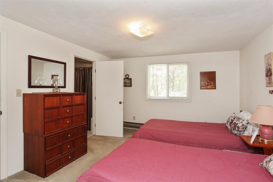 50 Indian Walk Road Wellfleet, MA 02667 - Photo 10 of 21 a bedroom with a bed and a dresser