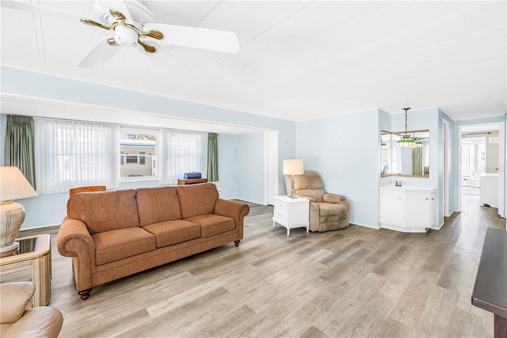 1100 South Belcher Road, Unit 502 Largo, FL 33771 - Photo 17 of 51 a living room with furniture and a wooden floor