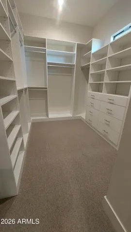 a view of an empty walk in closet