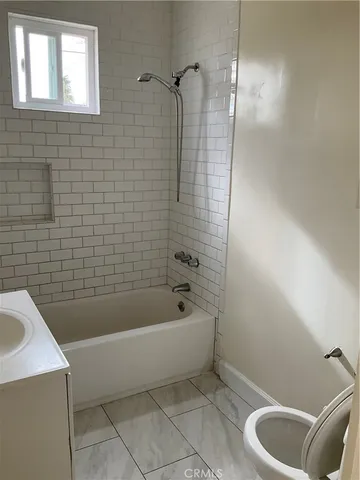 a bathroom with a sink and bathtub
