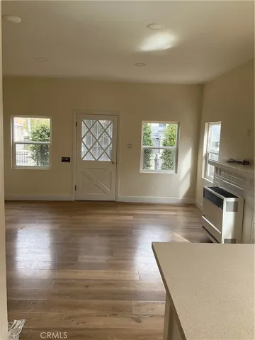 a living room with furniture wooden floor and a fireplace