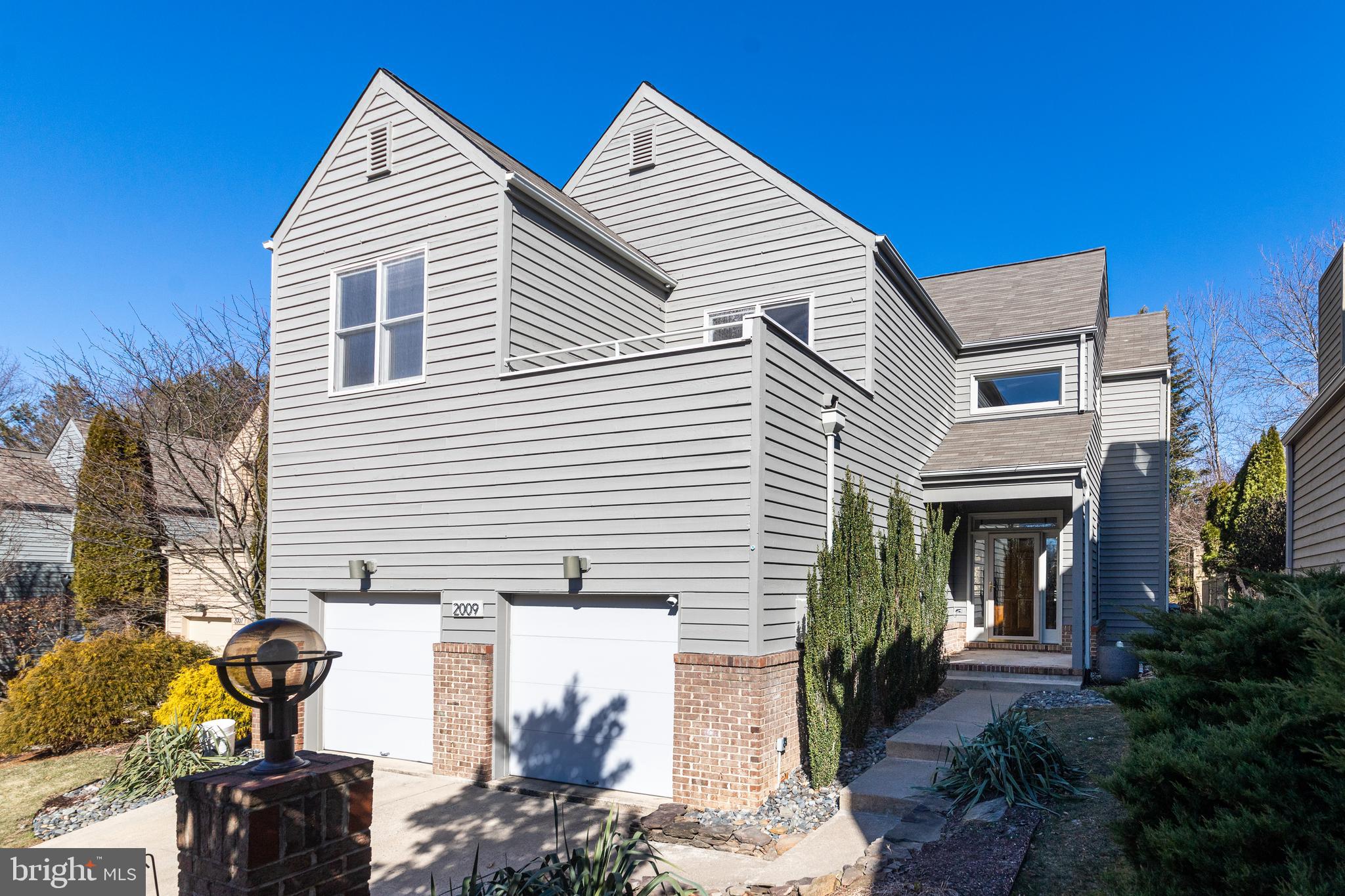 2009 Beacon Place Reston, VA 20191 - Photo 1 of 40 a view of a house with a yard