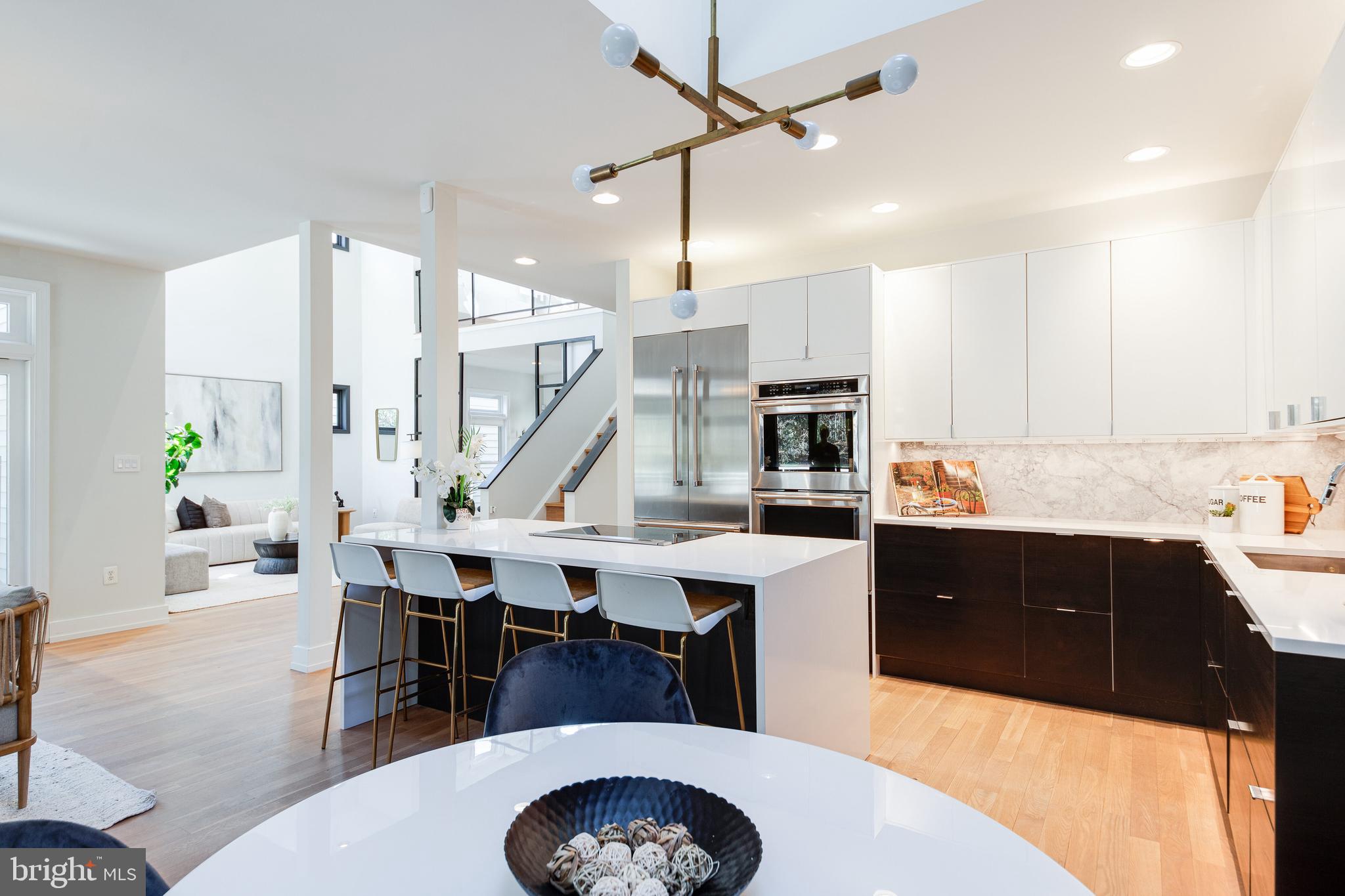 2009 Beacon Place Reston, VA 20191 - Photo 12 of 40 a large kitchen with a table and chairs