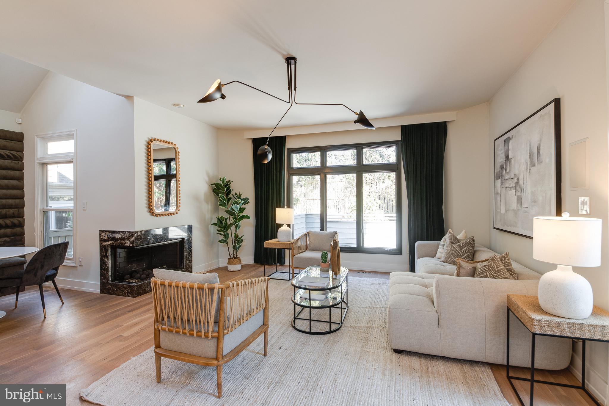 2009 Beacon Place Reston, VA 20191 - Photo 14 of 40 a living room with furniture chandelier and wooden floor