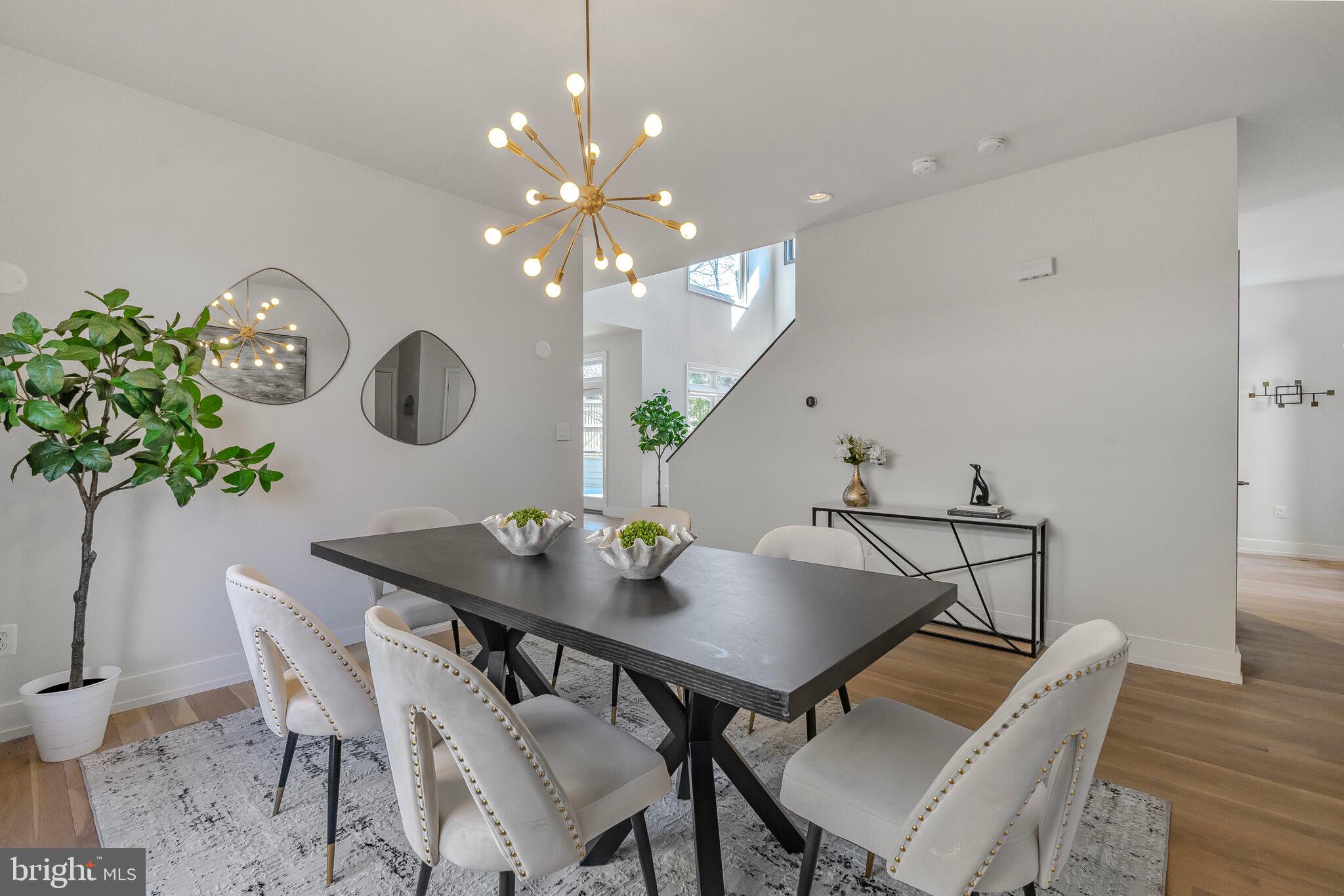 2009 Beacon Place Reston, VA 20191 - Photo 18 of 40 a view of a dining room and chandelier