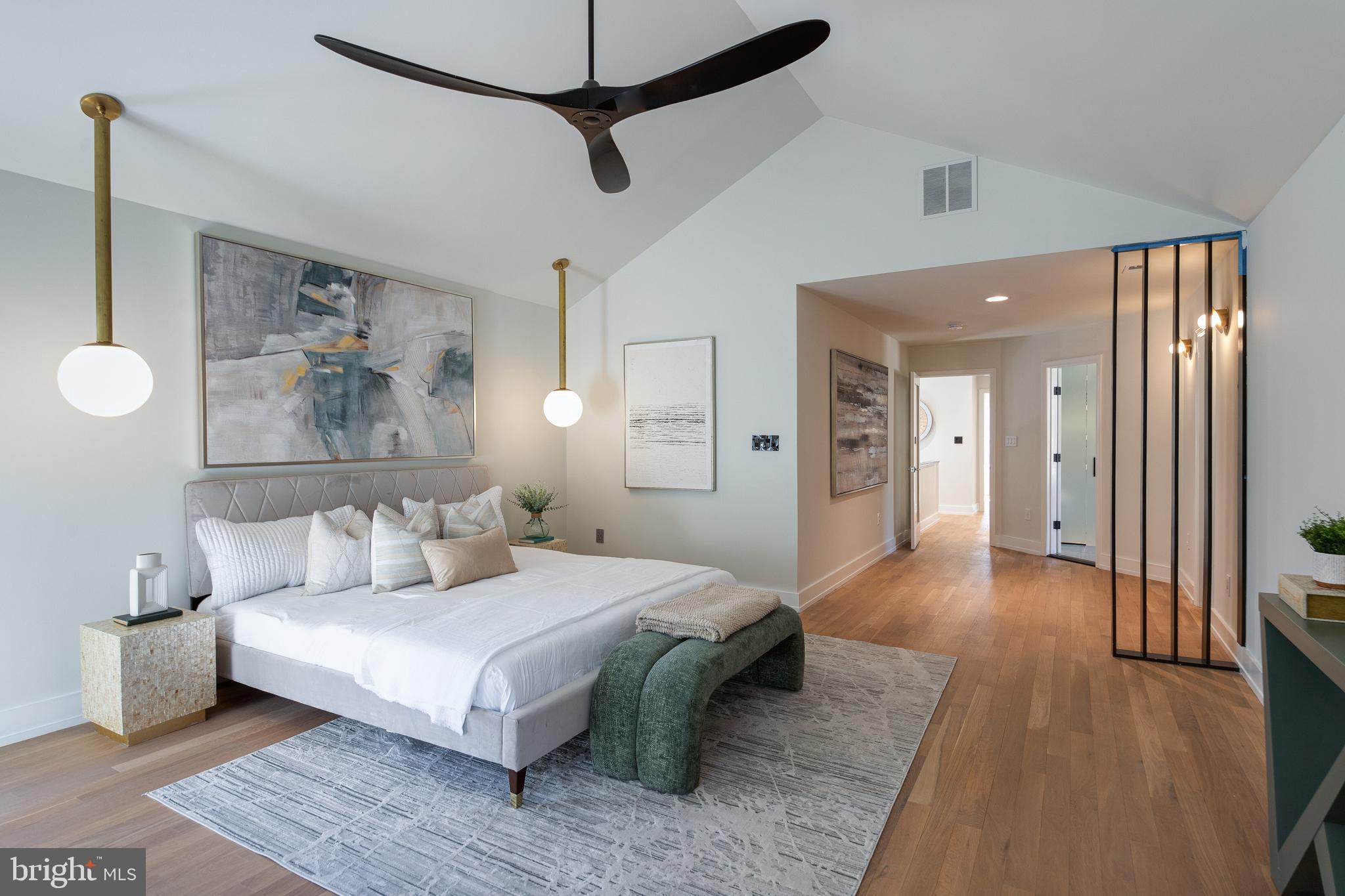 2009 Beacon Place Reston, VA 20191 - Photo 23 of 40 a spacious bedroom with a bed and a chandelier