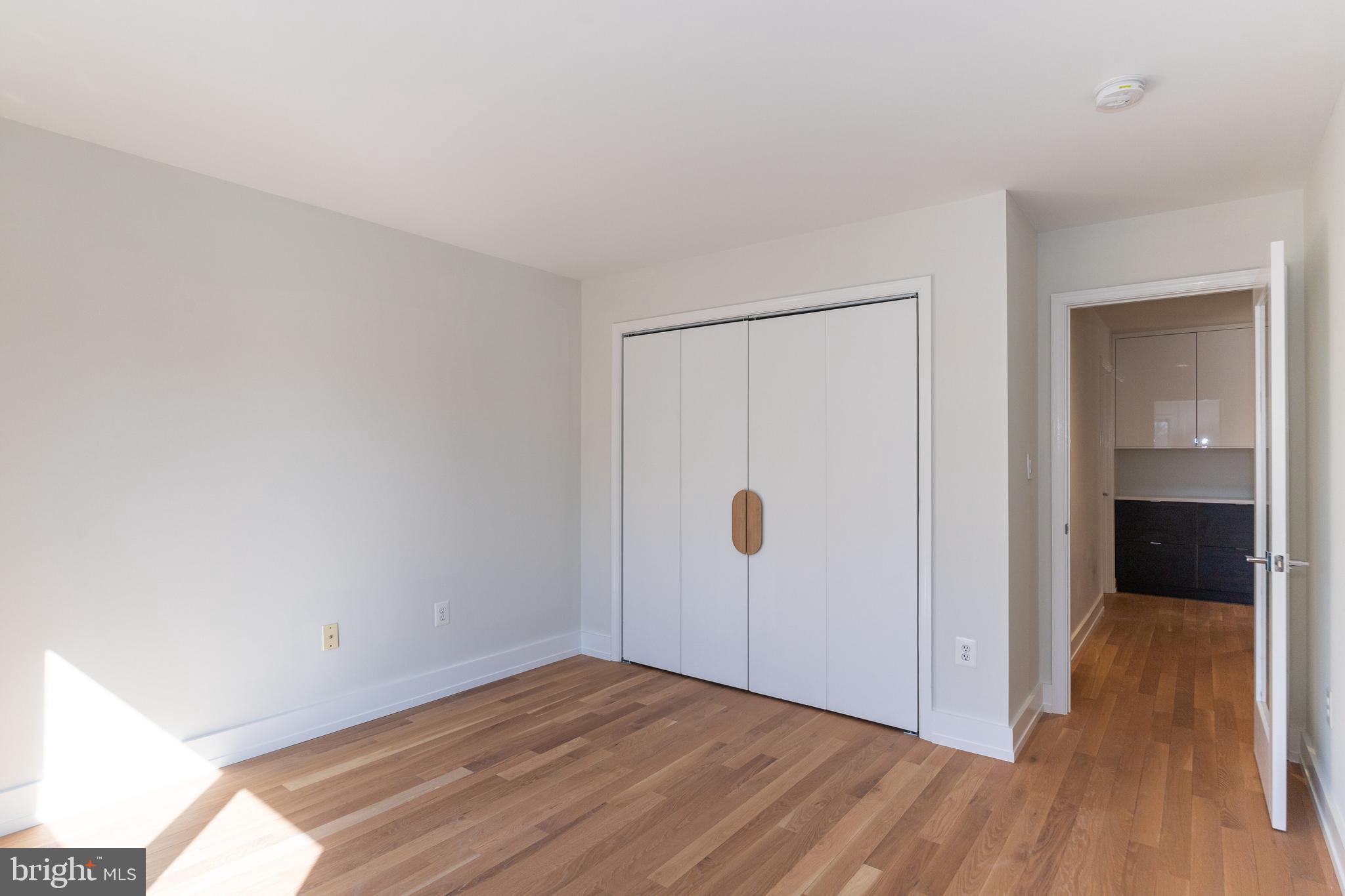 2009 Beacon Place Reston, VA 20191 - Photo 31 of 40 a view of an empty room and wooden floor