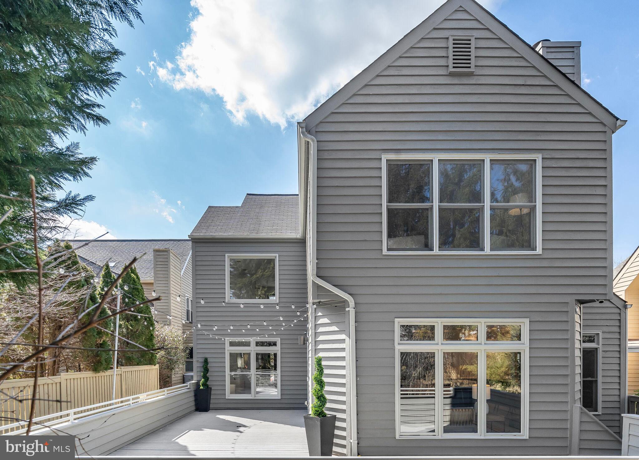 2009 Beacon Place Reston, VA 20191 - Photo 38 of 40 a front view of a house with a yard