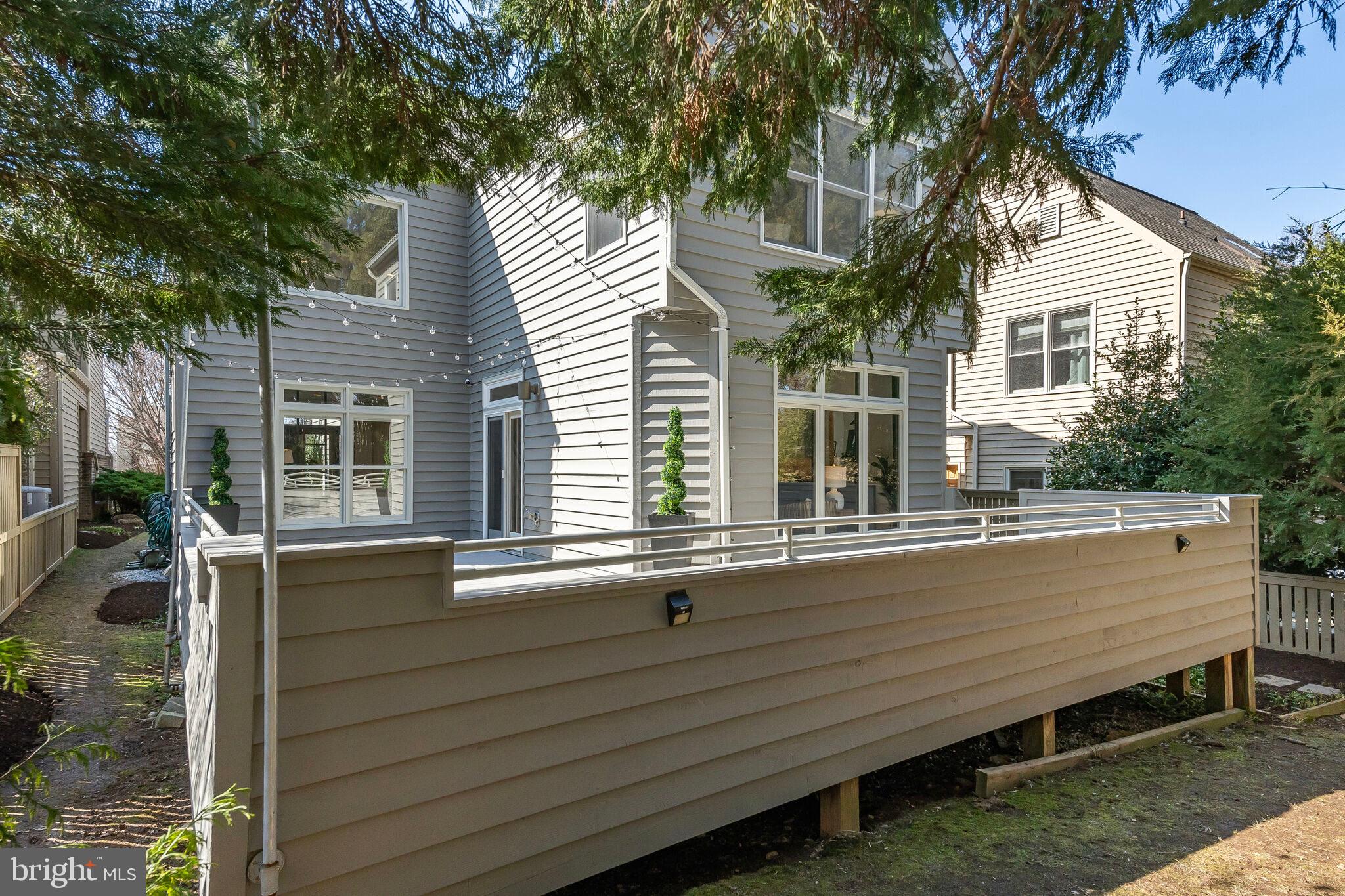 2009 Beacon Place Reston, VA 20191 - Photo 39 of 40 a view of a house with a large window and wooden fence