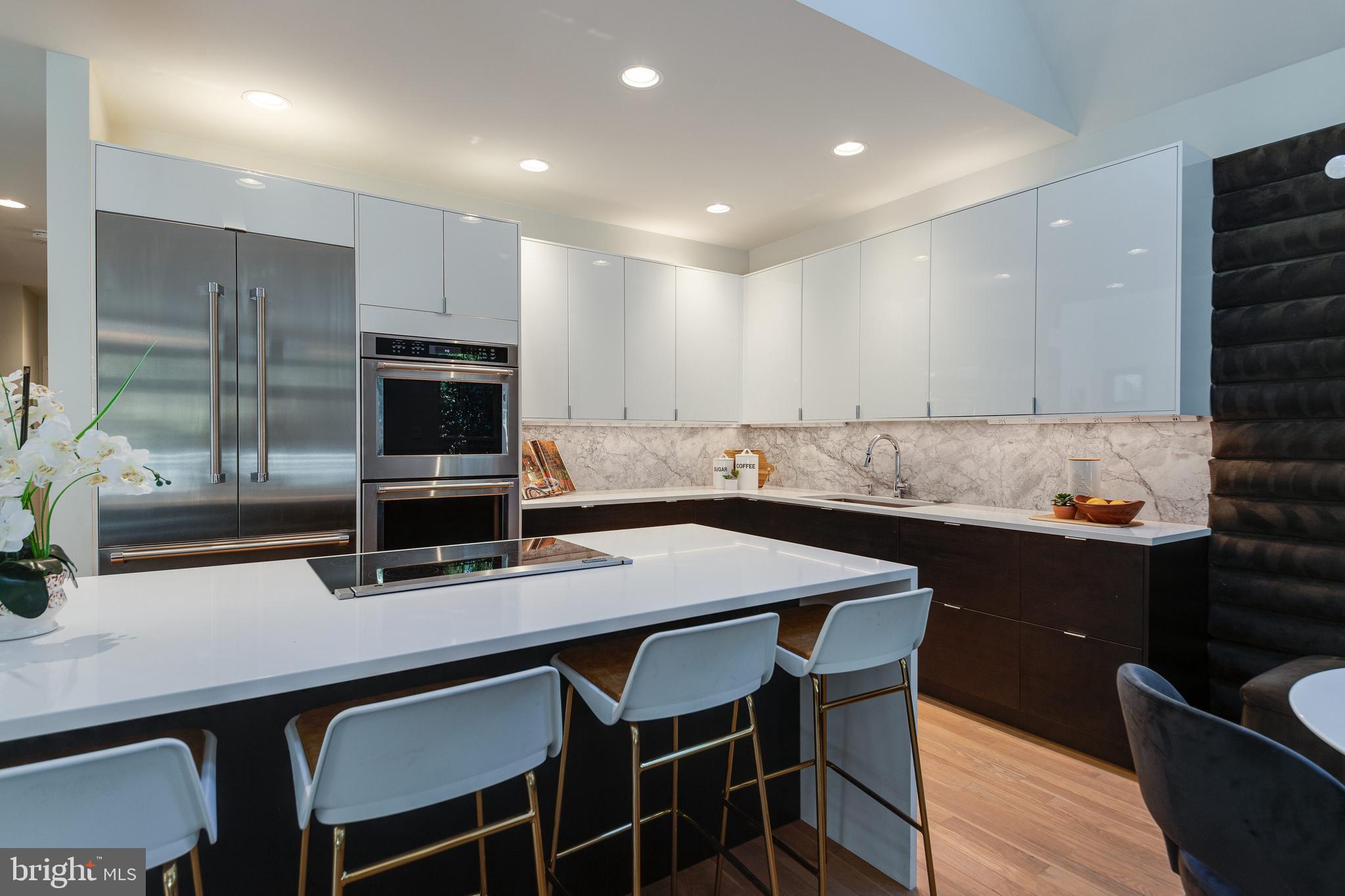 2009 Beacon Place Reston, VA 20191 - Photo 9 of 40 a kitchen with white cabinets a sink and dishwasher