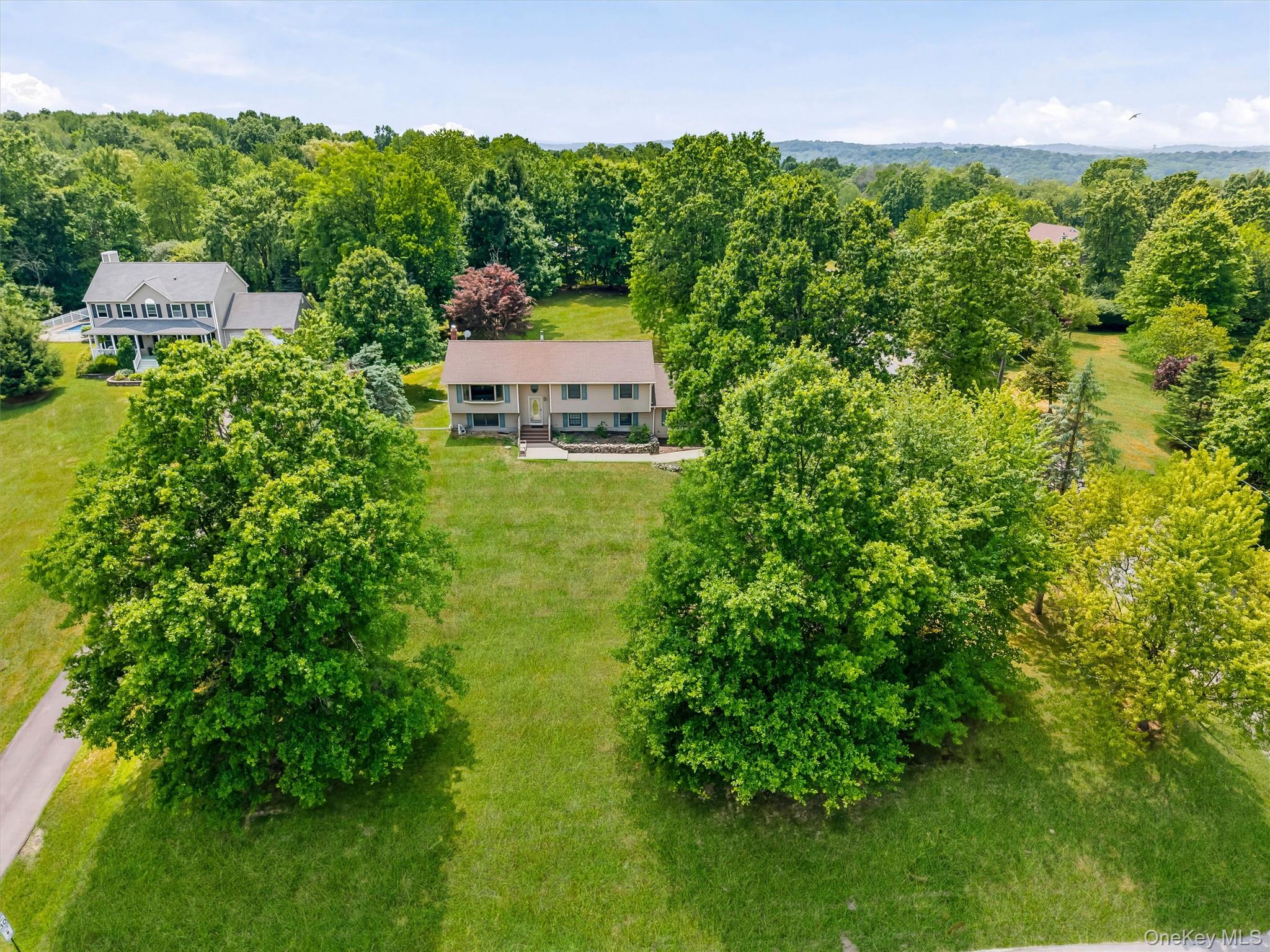 318 Beattie Road Washingtonville, NY 10992 - Photo 2 of 42 an aerial view of a house with a yard