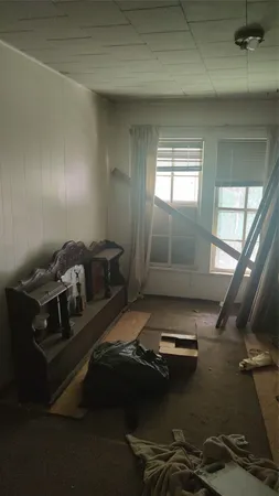 view of room with window and ceiling fan