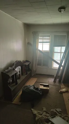 view of room with window and ceiling fan