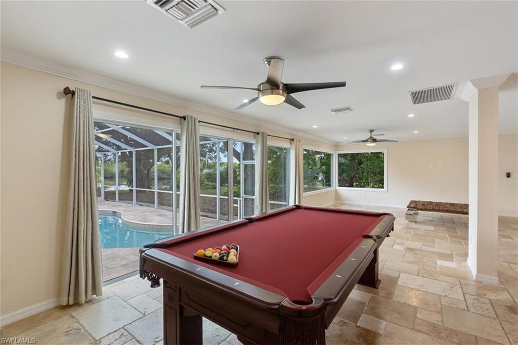4851 Riverside Drive Estero, FL 33928 - Photo 11 of 35 a room with pool table and windows