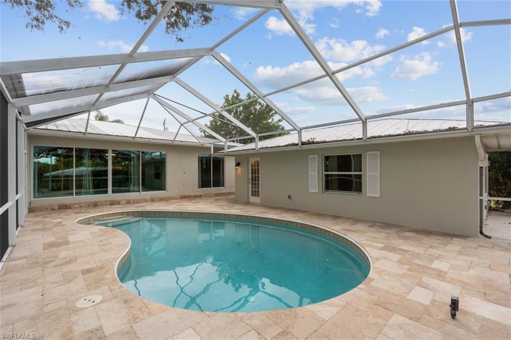 4851 Riverside Drive Estero, FL 33928 - Photo 27 of 35 a view of a house with a swimming pool